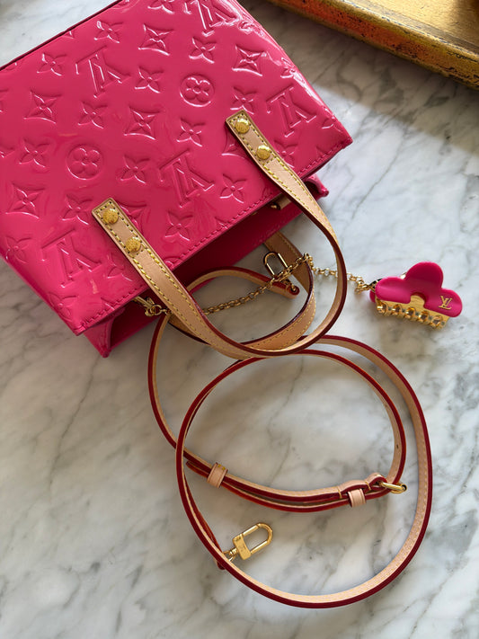 Pink handbag with hair clip